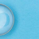 Magnifying Glass on a Blue Background